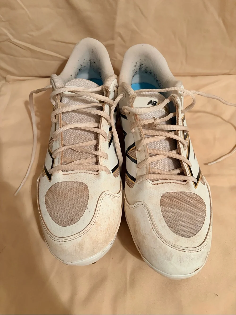 New Balance White and Beige Baseball Cleats with Black Accents